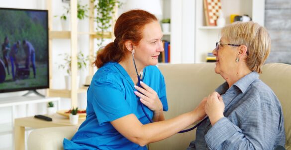 caucasian-female-doctor-nursing-home-listening-old-woman-heartbeat-with-stethoscope-min