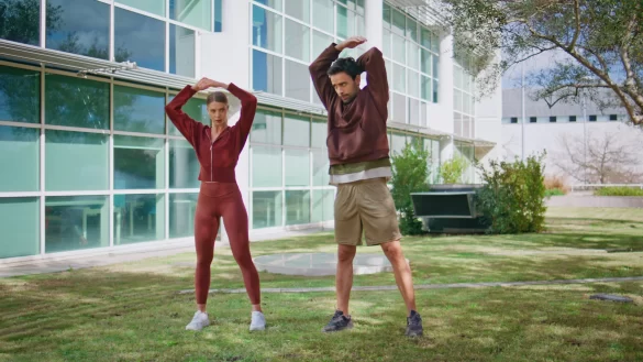 couple-doing-warming-exercise-city-park-two-athletes-training-morning
